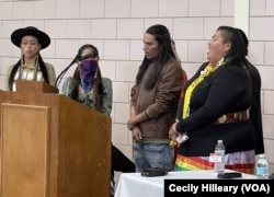 Indigenous Youth Council members pray during a ceremony marking the return of sacred artifacts to the Lakota, Sat. Nov. 5, 2022, Barre Mass.