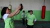 FILE - Afghan girls training to be boxers work at their gym in Ghazi Stadium Kabul, Afghanistan, Oct. 23, 2007.