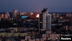 An explosion after a Russian drone strike is seen in the sky over the city during a Russian missile attack in Kyiv, Ukraine, Nov. 3, 2024. 