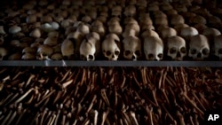FILE - Skulls and bones of some of those killed in Rwanda's genocide are seen at a memorial shrine in Ntarama, Rwanda, April 4, 2014. A designation of genocide does not require any particular action by the U.S.
