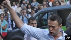 FILE - In this file photo taken on Friday, Aug. 17, 2012, Russian protest leader Alexei Navalny gestures as he walks outside a court in Moscow, Russia. 