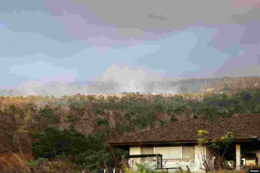 Smoke rises from a wildfire near Pukalani, Hawaii, Aug. 9, 2023.