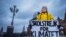 FILE - Swedish girl Greta Thunberg, 15, holds a placard reading "School strike for the climate" during a manifestation against climate change outside the Swedish parliament in Stockholm, Sweden, Nov. 30, 2018.