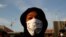 A protester wearing a protective mask attends a banned demonstration planned in memory of Adama Traore, a 24-year-old black Frenchman who died in a 2016 police operation, in front of courthouse in Paris, France June 2, 2020. . 