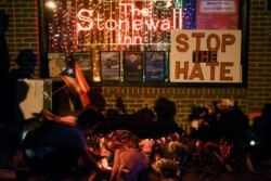 The memorial outside The Stonewall Inn, considered by many the center of New York's gay rights movement, after the massacre at the Pulse nightclub in Orlando, Fla., June 12, 2016.