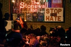 The memorial outside The Stonewall Inn, considered by many the center of New York's gay rights movement, after the massacre at the Pulse nightclub in Orlando, Fla., June 12, 2016.