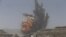 Smoke rises during an airstrike on an army weapons depot on a mountain overlooking Yemen's capital Sana'a.