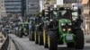 Greek farmers drive their tractors as they gather during a protest against shrinking incomes, rising costs and what they say are increasingly onerous environmental rules, in Athens on Feb. 20, 2024.
