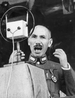FILE - Gen. Chiang Kai-shek, Chinese strongman, delivers a stirring appeal to his people by radio in an undated photo.