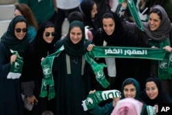 FILE - Saudi women supporters celebrate after Saudi Arabia won the World Cup group C soccer match between Argentina and Saudi Arabia at the Lusail Stadium in Lusail, Qatar, on Nov. 22, 2022.