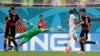 United States' goalkeeper Tim Howard is unable to stop a shot by Thomas Mueller, scoring Germany's first goal during the group G World Cup soccer match between the United States and Germany in Recife, Brazil, June 26, 2014.