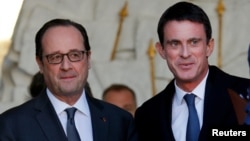 法國總統奧朗德(左)與法國社會黨成員、總理曼努埃爾瓦爾斯(右)。