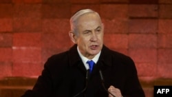 以色列总理本雅明·内塔尼亚胡（Benjamin Netanyahu）星期日（2024年5月5日）在以色列犹太人大屠杀纪念馆的一项纪念活动上发表讲话。（法新社）
