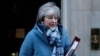 Britain's PM Theresa May leaving 10 Downing Street, Jan. 30, 2019. May is gathering pro-Brexit and pro-EU Conservative lawmakers into an "alternative arrangements working group" seeking to break Britain's Brexit deadlock.