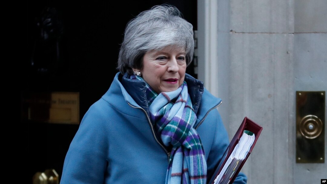 Britain's PM Theresa May leaving 10 Downing Street, Jan. 30, 2019. May is gathering pro-Brexit and pro-EU Conservative lawmakers into an "alternative arrangements working group" seeking to break Britain's Brexit deadlock.
