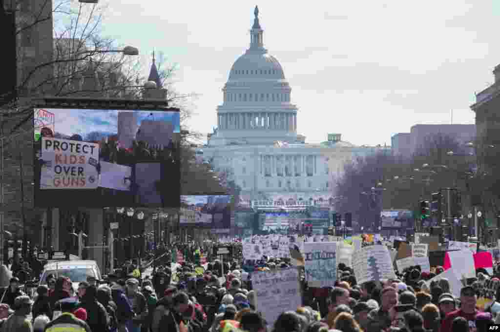 Participants take part in the &quot;March for Our Lives&quot; rally in Washington, DC on March 24, 2018. (AFP PHOTO / ANDREW CABALLERO-REYNOLDS)