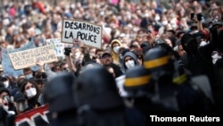 Demonstrators attend a protest against police brutality and the death in Minneapolis police custody of George Floyd, in Nantes, France, June 13, 2020. 