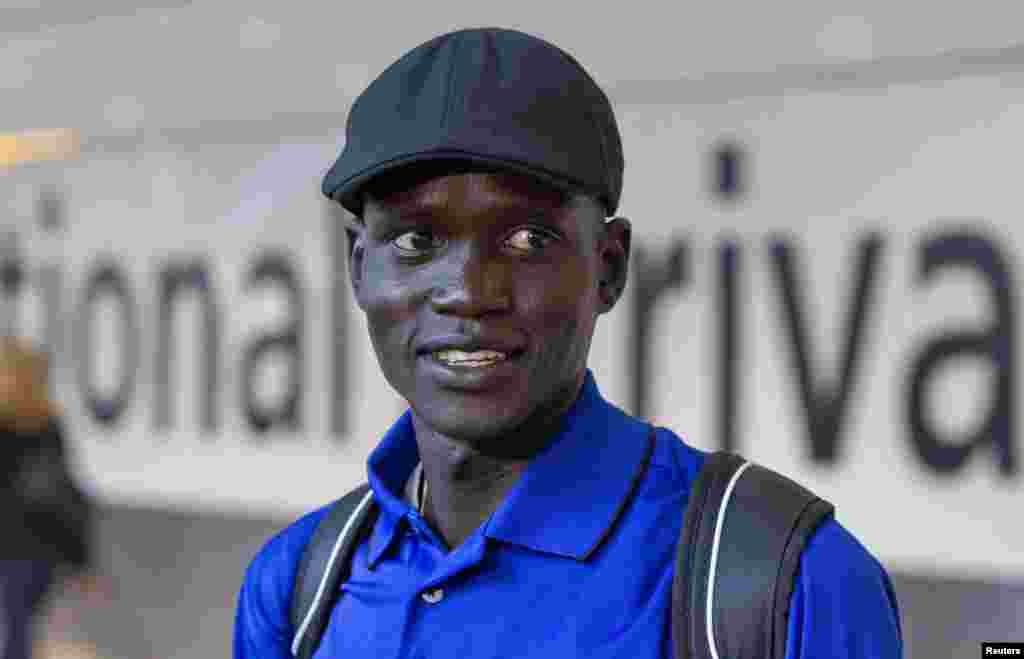 Marathon runner Guor Marial arrives at Heathrow Airport for the London 2012 Olympic Games, August 3, 2012. 
