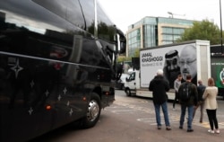 FILE - A van tying the murder Saudi journalist Jamal Khashoggi to Saudi Arabia's crown prince drives outside a stadium during a match between Newcastle United and Tottenham Hotspur, at St James' Park in Newcastle, England, Oct. 17, 2021.