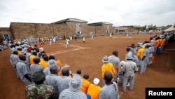 Kenyan prisoners watch a mock World Cup soccer match between Russia and Saudi Arabia, as part of a month-long soccer tournament involving eight prison teams at the Kamiti Maximum Prison, Kenya's largest prison facility, near Nairobi, Kenya, June 14, 2018.