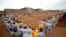 Kenyan prisoners watch a mock World Cup soccer match between Russia and Saudi Arabia, as part of a month-long soccer tournament involving eight prison teams at the Kamiti Maximum Prison, Kenya's largest prison facility, near Nairobi, Kenya, June 14, 2018.