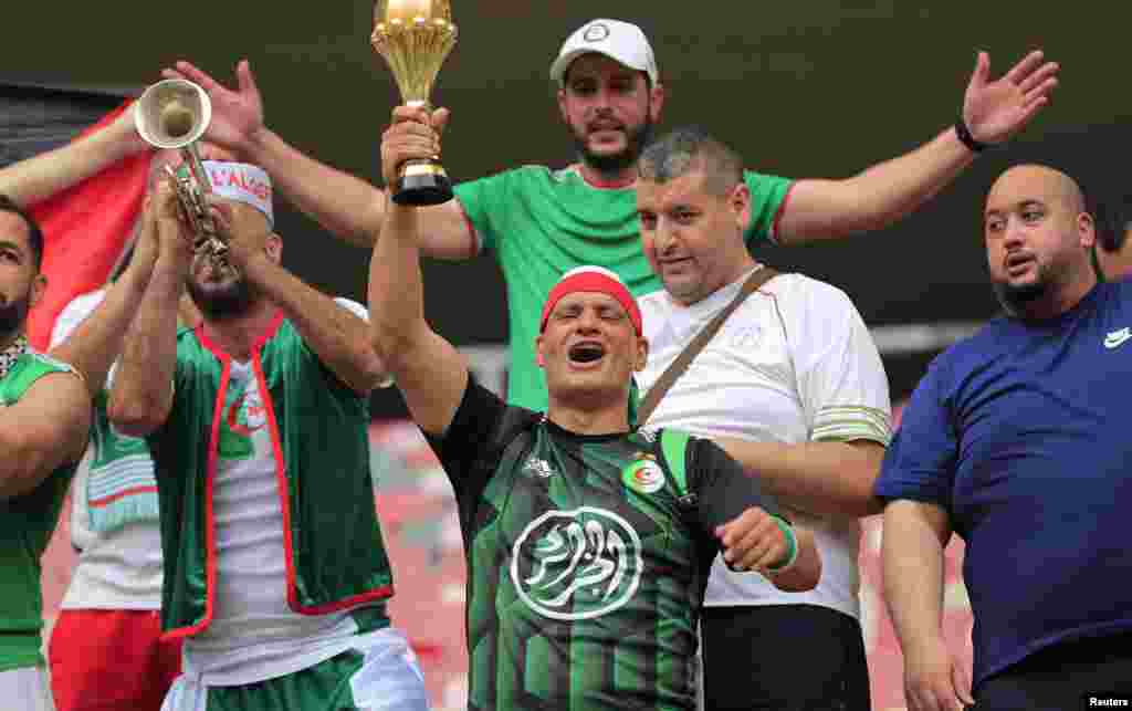 Algerian fans await the match with Sierra Leone.