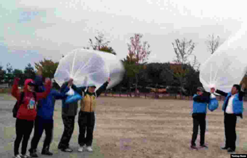 Shani Davis of the U.S. skates in the prototype of the official US Speedskating suit during a training session at the Adler Arena Skating Center at the 2014 Winter Olympics, Feb. 14, 2014.