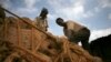 Men unload sacks of khat in Mandera, northeastern Kenya, Nov. 2007 file photo.