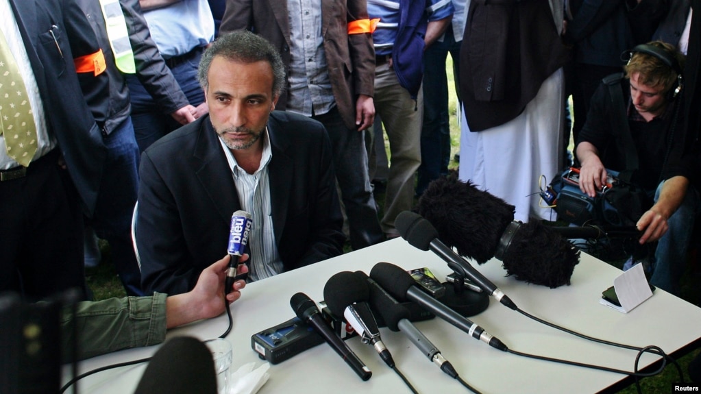 FILE - Tariq Ramadan talks to the media after a conference at the Er-Rahma mosque in Nantes, western France, April 25, 2010.