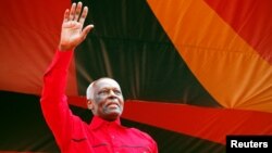 Outgoing Angolan President Jose Eduardo dos Santos greets crowds at the ruling MPLA party's final election rally in Luanda, Angola, Aug. 19, 2017.