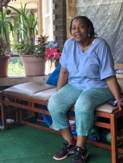 Deloris Knight of Detroit, Mich., sits on her front porch, July 17, 2019, as she prepares for the heat wave that will descend upon Detroit and a wide section of the Midwest.