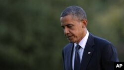 President Barack Obama walks from Marine One on the South Lawn of the White House, Washington, Sept. 13, 2012.