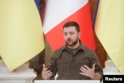 FILE - Ukraine's President Volodymyr Zelenskyy speaks during a news conference in Kyiv, May 8, 2022.