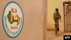 FILE —A Malian Army soldier with the G5 Sahel, an institutional framework for the coordination of regional cooperation in development policies and security matters in West Africa, is seen in Sevare, May 30, 2018.