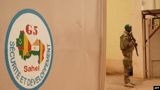 FILE - A Malian Army soldier with the G5 Sahel is seen in Sevare, May 30, 2018. Mali said May 15, 2022, it was withdrawing from a west African force fighting jihadists to protest its being rejected as head of the G5 regional group.