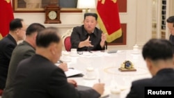 North Korean leader Kim Jong Un presides over a politburo meeting of the ruling Workers' Party, amid the COVID-19 pandemic, in Pyongyang, North Korea, May 17, 2022, in this photo released by North Korea's Korean Central News Agency (KCNA).