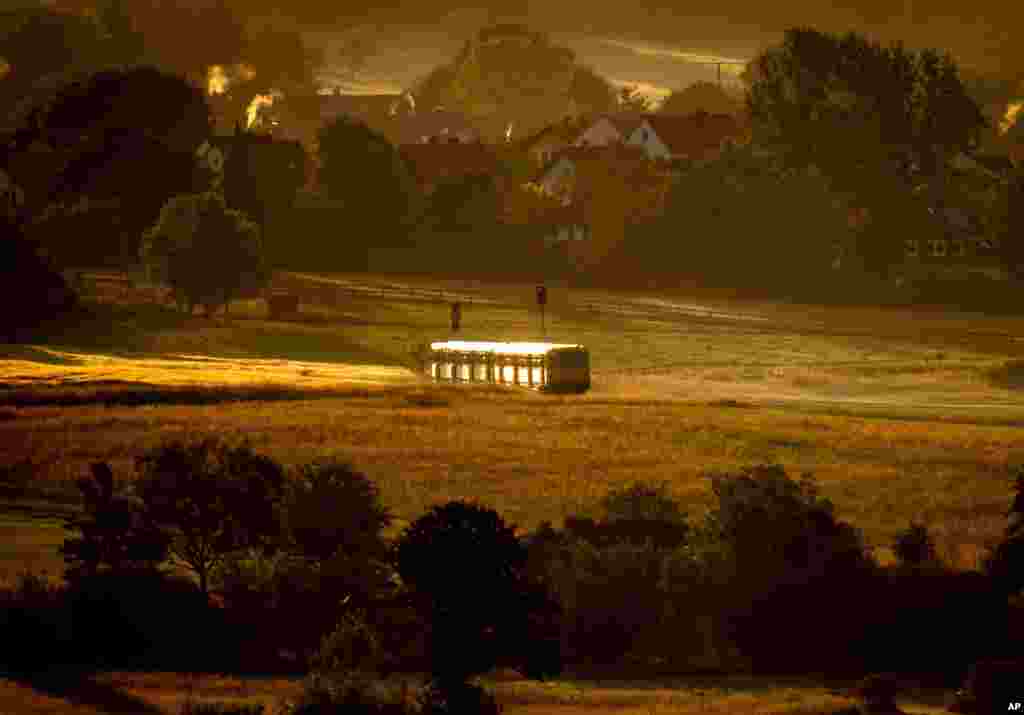 A regional train approaches the city of Wehrheim near Frankfurt, Germany.