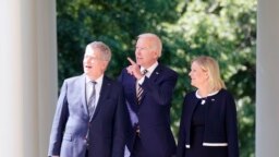 President Joe Biden accompanied by Swedish Prime Minister Magdalena Andersson and Finnish President Sauli Niinisto, walks out to speak in the Rose Garden of the White House, May 19, 2022.