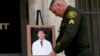 Orange County Sheriff's Sgt. Scott Steinle displays a photo of Dr. John Cheng, a 52-year-old victim who was killed in Sunday's shooting at Geneva Presbyterian Church, during a news conference in Santa Ana, Calif., Monday, May 16, 2022. (AP Photo/Jae C. Ho)