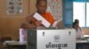 FILE - A Buddhist monk votes at a polling station in Phnom Penh, Cambodia, Sunday, July 29, 2018. With the main opposition silenced, Cambodians were voting in an election Sunday virtually certain to return to office Prime Minister Hun Sen and his party (AP Photo/Heng Sinith)