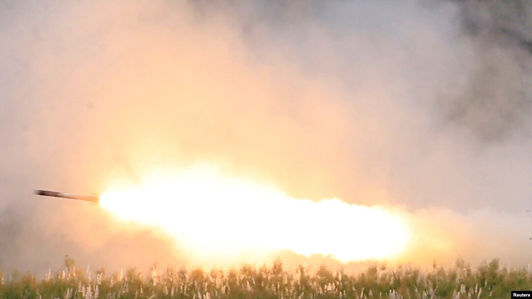 FILE - US military forces fire a High Mobility Artillery Rocket System (HIMARS) rocket during the annual Philippines-US live fire amphibious landing exercise (PHIBLEX) at Crow Valley in Capas, Tarlac province, north of Manila, Philippines, Oct. 10, 2016.
