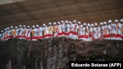 FILE - Priests chant and dance during the celebration of Genna, the Ethiopian Orthodox Christmas, at Saint Mary's Church in Lalibela, Ethiopia, Jan. 7, 2022.