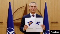 NATO Secretary-General Jens Stoltenberg attends a ceremony to mark Sweden's and Finland's application for membership in Brussels, Belgium, May 18, 2022. 