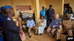 FILE: United Nations High Commissioner for refugees (UNHCR) Filippo Grandi (2nd R), Gao's Governor Sidiki Samake (R) and UNHCR's representative in Mali Angele Djohossou (3rd R) visit the center for migrants in transit and reception in Gao, June 23, 2018. 