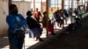 People queue at a COVID-19 testing center in Soweto, South Africa, May 11, 2022.