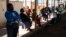 People queue at a COVID-19 testing center in Soweto, South Africa, May 11, 2022.