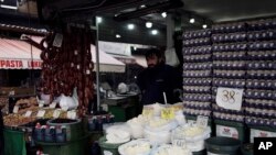 A man stands in a food shop in Ulus district of the capital Ankara, Turkey, May 5, 2022 where Inflation soared to nearly 70% in April.