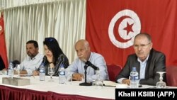 FILE: Noureddine Taboubi (R), Secretary-General of the Tunisian General Labor Union (UGTT), chairs the meeting of the body's national administrative commission in Hammamet on May 23, 2022.