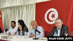 FILE: Noureddine Taboubi (R), Secretary-General of the Tunisian General Labour Union (UGTT), chairs the meeting of the body's national administrative commission in Hammamet on May 23, 2022. 