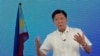 FILE - Presidential candidate Ferdinand "Bongbong" Marcos Jr. gestures during a live broadcast at his headquarters in Mandaluyong, Philippines, May 11, 2022. 